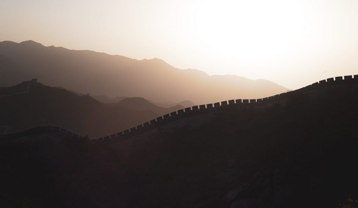 drone shot of the great wall of china during sunset