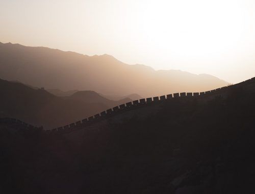 drone shot of the great wall of china during sunset
