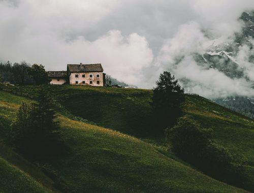 white and gray house on mountain