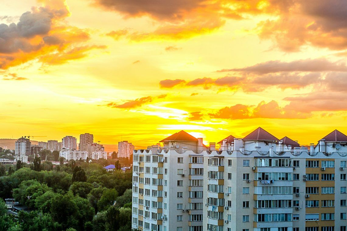 gray white high rise building during sun set