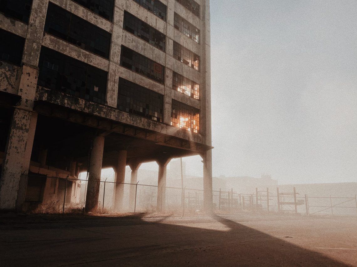 abandoned concrete building under white sky