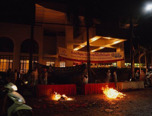 fire burning in the city street at night