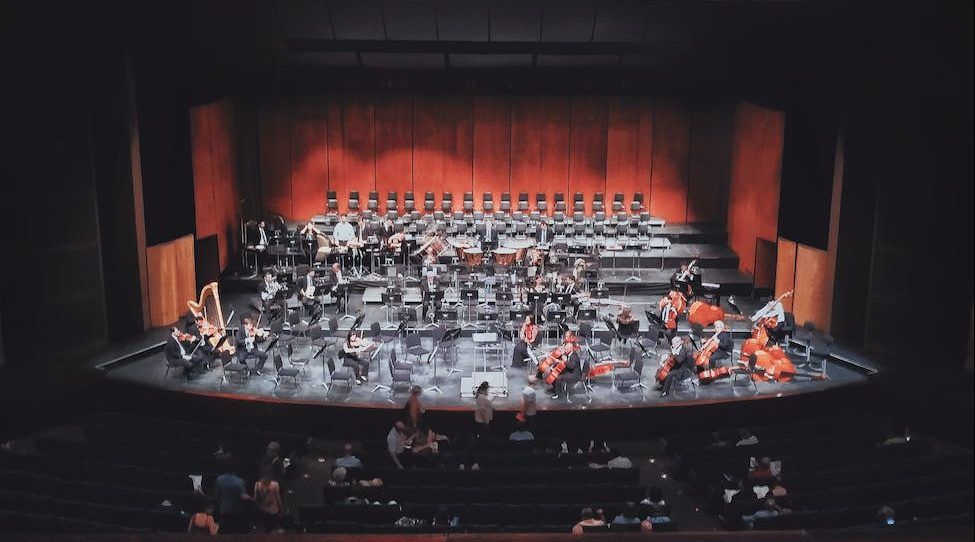people watching play on stage