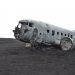 gray airplane on seashore