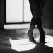 crop ballerina silhouette dancing on floor with shadow