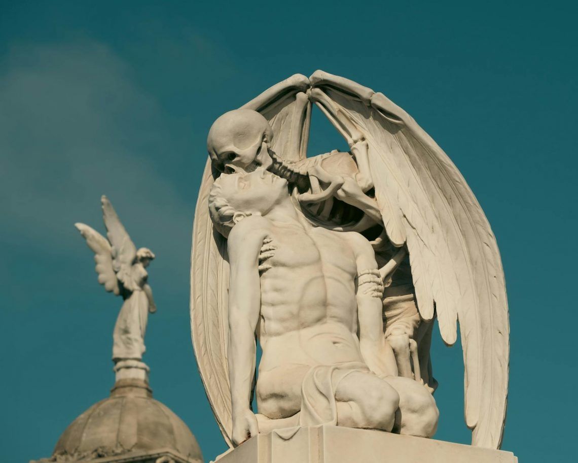 the kiss of death sculpture in poblenou cemetery in barcelona spain